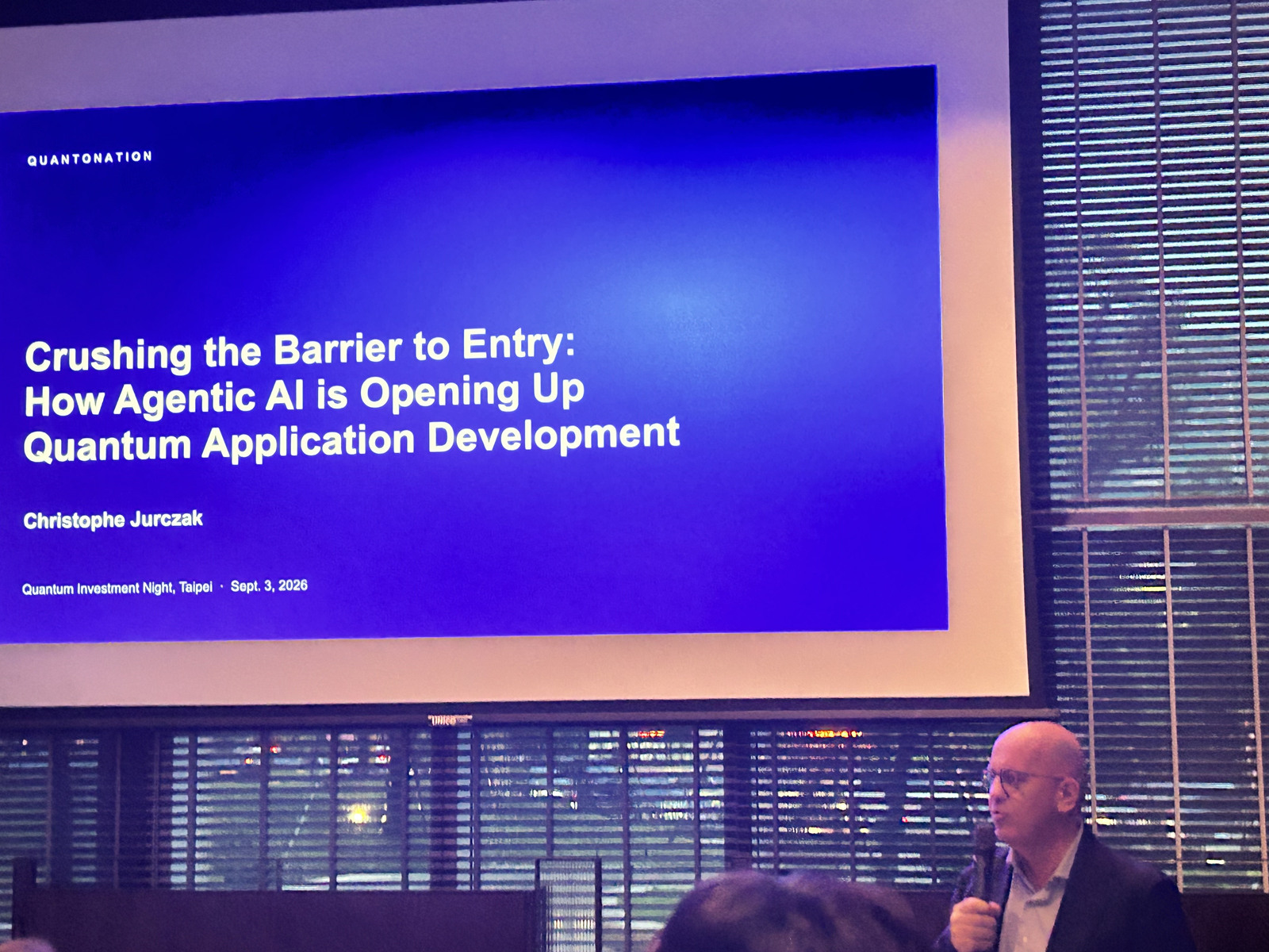 A speaker and an Agentic AI quantum application development slide dated September 3, 2026 at Quantum Investment Night