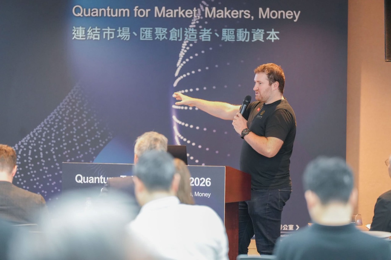 A speaker explains the presentation to participants